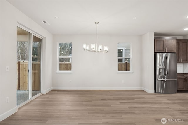 20424 E 97th Ave E Unit 6, Graham, WA 98338 - unfurnished dining area featuring a chandelier, light wood finished floors, and recessed lighting