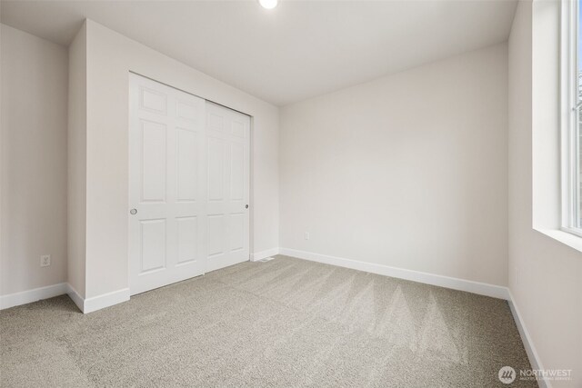 20424 E 97th Ave E Unit 6, Graham, WA 98338 - unfurnished bedroom featuring carpet and baseboards