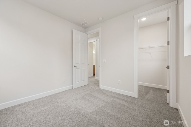 20424 E 97th Ave E Unit 6, Graham, WA 98338 - unfurnished bedroom with carpet flooring, a walk in closet, and a closet
