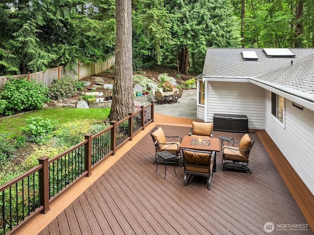 12810 NE 32nd Pl, Bellevue, WA 98005 - wooden deck with an outdoor fire pit and outdoor dining area