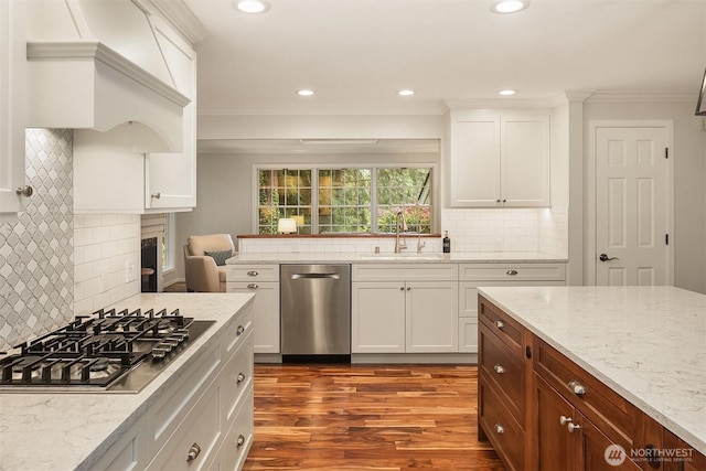 12810 NE 32nd Pl, Bellevue, WA 98005 - kitchen with appliances with stainless steel finishes, dark wood-style floors, decorative backsplash, a fireplace, and recessed lighting