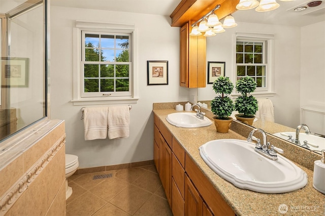 12810 NE 32nd Pl, Bellevue, WA 98005 - full bath featuring double vanity, an enclosed shower, and tile patterned flooring