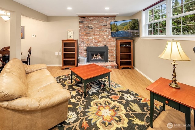 12810 NE 32nd Pl, Bellevue, WA 98005 - living room with a fireplace, wood finished floors, and recessed lighting