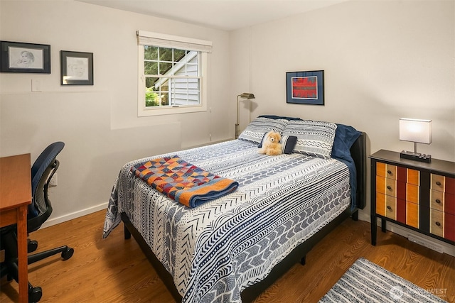 12810 NE 32nd Pl, Bellevue, WA 98005 - bedroom featuring wood finished floors and an office area