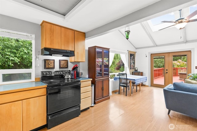 50 Hemlock Way, Sequim, WA 98382 - kitchen with electric range, under cabinet range hood, a skylight, light wood finished floors, and french doors