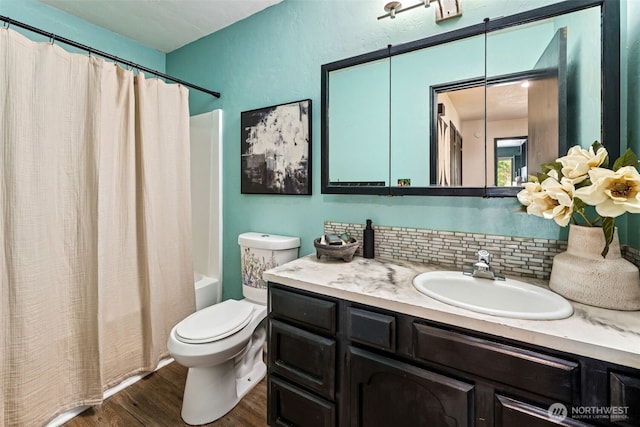 933 N Stephenson, Montesano, WA 98563 - full bathroom featuring shower / tub combo, vanity, wood finished floors, and tasteful backsplash