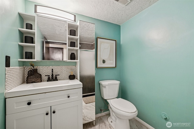 933 N Stephenson, Montesano, WA 98563 - bathroom featuring vanity, a textured ceiling, marble finish flooring, and backsplash