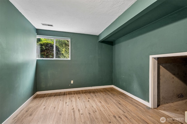 933 N Stephenson, Montesano, WA 98563 - spare room with wood finished floors and a textured ceiling