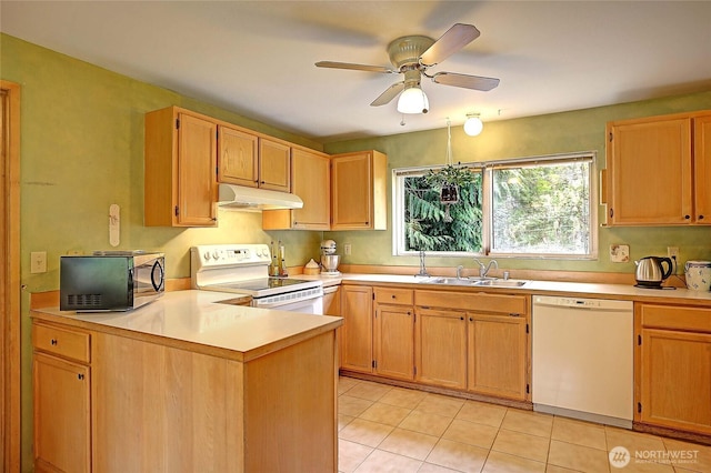 657 SW Camano Dr, Camano Island, WA 98282 - kitchen with white appliances, under cabinet range hood, light countertops, a ceiling fan, and light tile patterned flooring