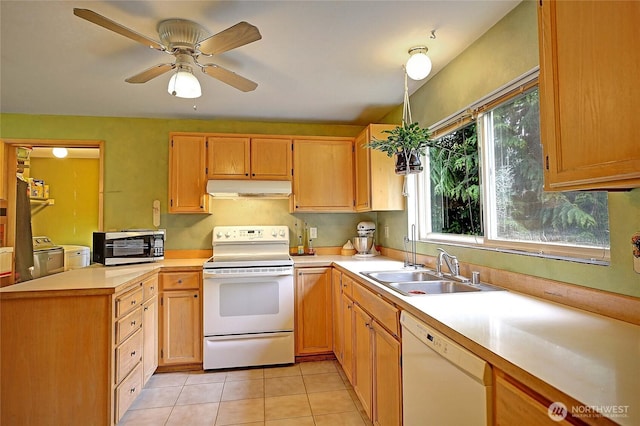 657 SW Camano Dr, Camano Island, WA 98282 - kitchen featuring white appliances, under cabinet range hood, washer and clothes dryer, light countertops, and light tile patterned floors