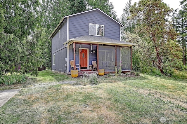657 SW Camano Dr, Camano Island, WA 98282 - view of front facade with a sunroom and a front yard