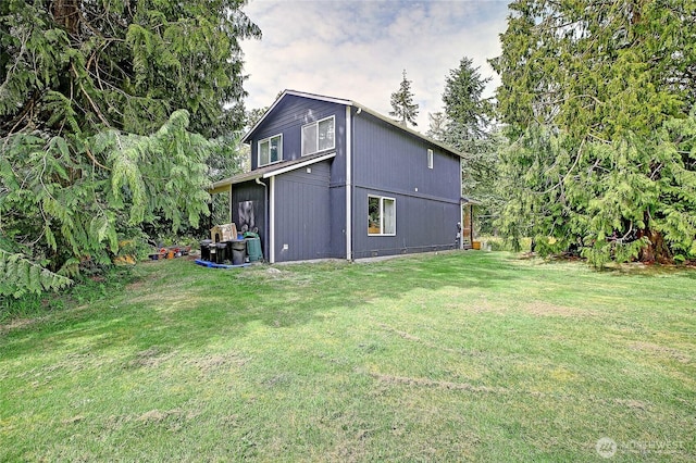 657 SW Camano Dr, Camano Island, WA 98282 - view of side of home featuring a lawn