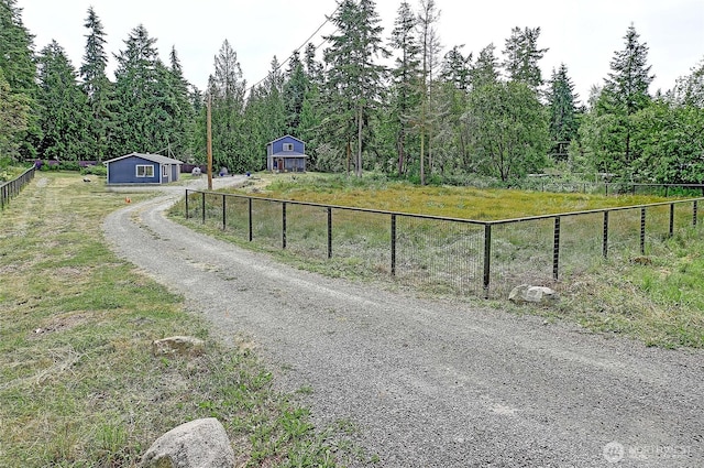 657 SW Camano Dr, Camano Island, WA 98282 - view of dirt / gravel road featuring a view of trees