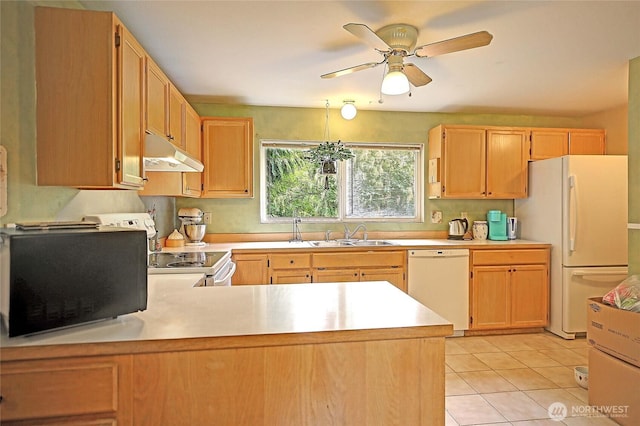 657 SW Camano Dr, Camano Island, WA 98282 - kitchen featuring under cabinet range hood, white appliances, light countertops, and light tile patterned floors