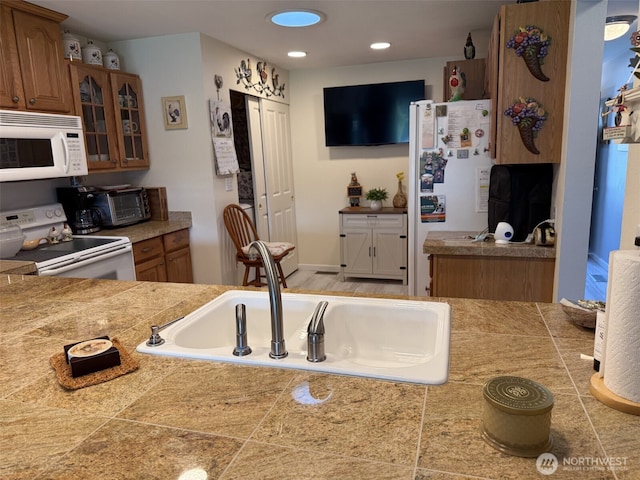 2748 SW 327th St S, Federal Way, WA 98023 - kitchen featuring white appliances, tile countertops, glass insert cabinets, and recessed lighting