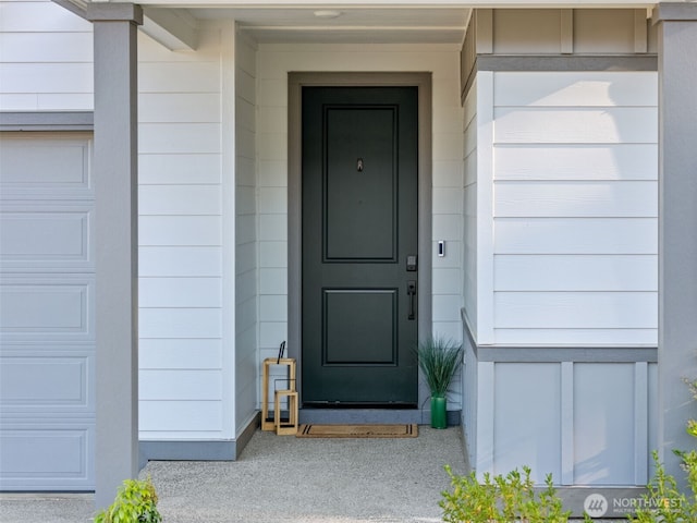 2405 NE Waterlily Way, Poulsbo, WA 98370 - doorway to property with a garage