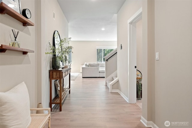 2405 NE Waterlily Way, Poulsbo, WA 98370 - hallway with light wood-style flooring, recessed lighting, and stairway