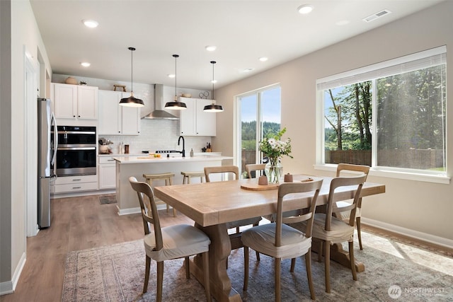 2405 NE Waterlily Way, Poulsbo, WA 98370 - dining space with recessed lighting and light wood-style floors