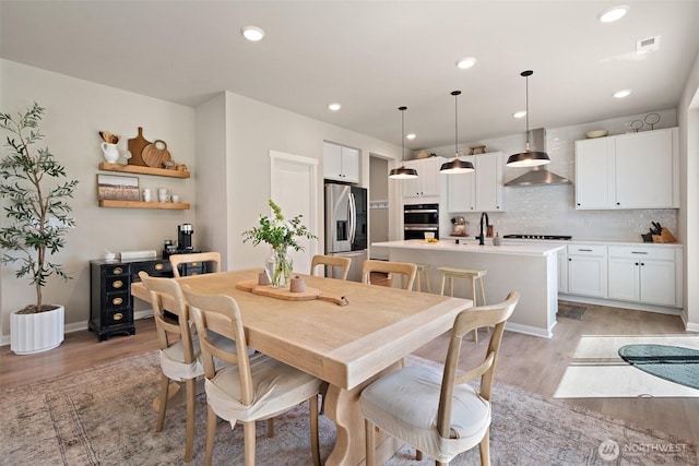 2405 NE Waterlily Way, Poulsbo, WA 98370 - dining area featuring light wood-style floors and recessed lighting