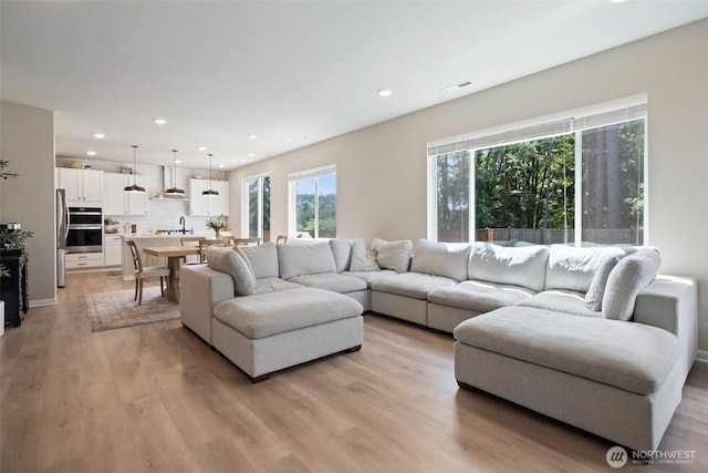 2405 NE Waterlily Way, Poulsbo, WA 98370 - living area with light wood-style flooring and recessed lighting