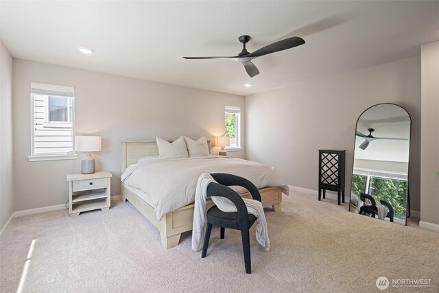 2405 NE Waterlily Way, Poulsbo, WA 98370 - bedroom with carpet flooring, multiple windows, a ceiling fan, and recessed lighting