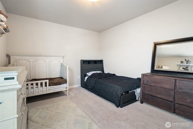 2405 NE Waterlily Way, Poulsbo, WA 98370 - bedroom featuring light colored carpet and baseboards