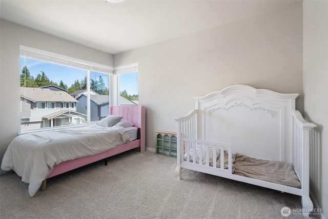 2405 NE Waterlily Way, Poulsbo, WA 98370 - bedroom with carpet flooring and baseboards