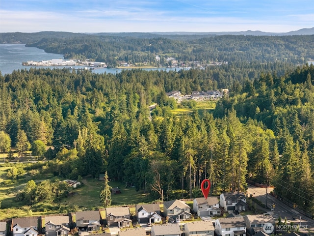 2405 NE Waterlily Way, Poulsbo, WA 98370 - aerial overview of property's location with a heavily wooded area and a large body of water