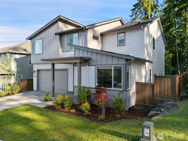 2405 NE Waterlily Way, Poulsbo, WA 98370 - view of front of house with board and batten siding, an attached garage, and driveway