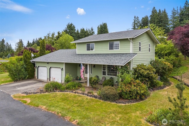 127 Springbrook Dr, Chehalis, WA 98532 - traditional-style house featuring a garage, roof with shingles, driveway, a front yard, and a porch
