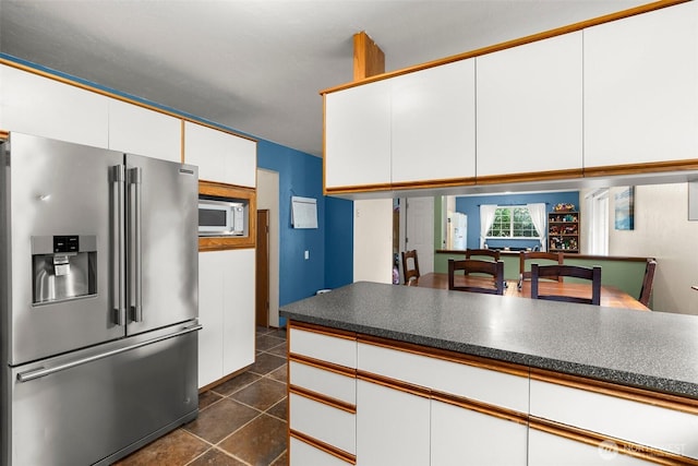 127 Springbrook Dr, Chehalis, WA 98532 - kitchen featuring high quality fridge, white cabinetry, dark tile patterned floors, dark countertops, and white microwave