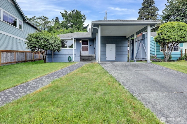 4723 50th Ave SW, Seattle, WA 98116 - view of front facade with asphalt driveway, an attached carport, and a shingled roof