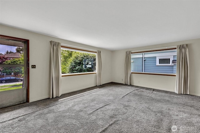 4723 50th Ave SW, Seattle, WA 98116 - unfurnished room featuring carpet floors and baseboards