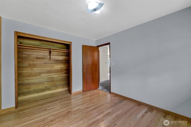 4723 50th Ave SW, Seattle, WA 98116 - unfurnished bedroom with light wood-style flooring and a closet