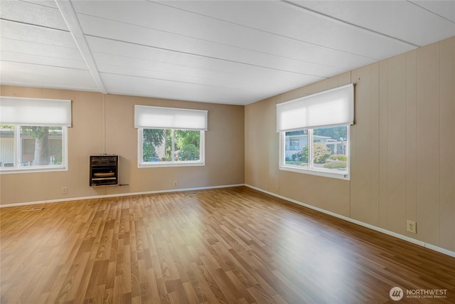 900 29th St SE Unit E-22, Auburn, WA 98002 - unfurnished living room featuring healthy amount of natural light and wood finished floors