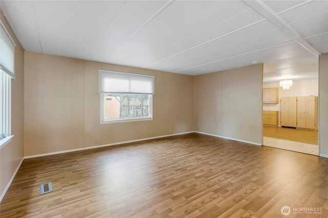 900 29th St SE Unit E-22, Auburn, WA 98002 - spare room featuring healthy amount of natural light and light wood-type flooring