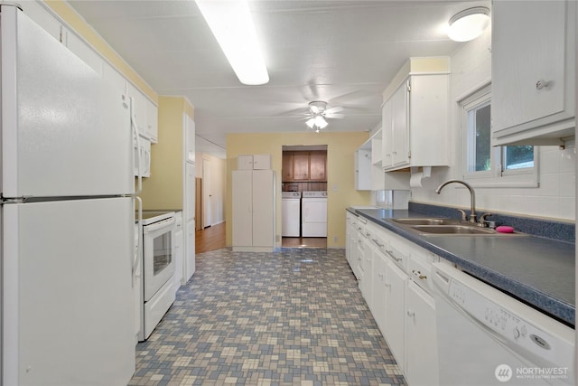 900 29th St SE Unit E-22, Auburn, WA 98002 - kitchen featuring white appliances, washer and clothes dryer, ceiling fan, white cabinets, and dark countertops
