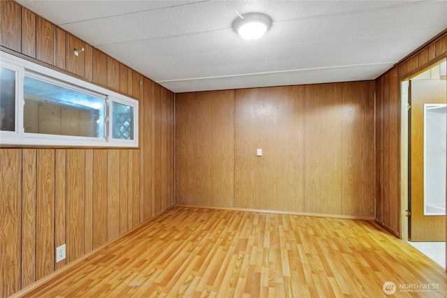 900 29th St SE Unit E-22, Auburn, WA 98002 - empty room with wood finished floors and wood walls