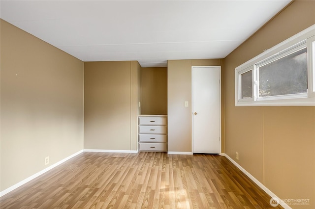 900 29th St SE Unit E-22, Auburn, WA 98002 - unfurnished room featuring light wood-style floors and baseboards