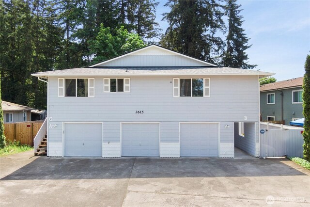 3615 Auburn Way S Unit B, Auburn, WA 98092 - view of front facade with a garage, concrete driveway, and a shingled roof