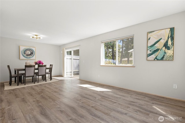 3615 Auburn Way S Unit B, Auburn, WA 98092 - dining room featuring wood finished floors and baseboards