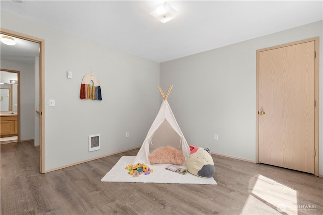 3615 Auburn Way S Unit B, Auburn, WA 98092 - playroom with wood finished floors and baseboards