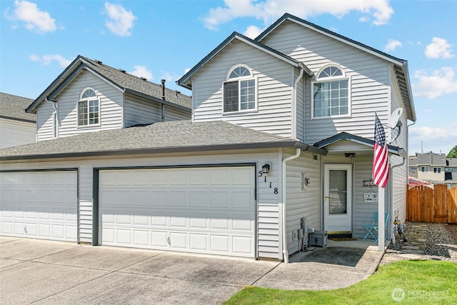 5118 NE 75th Ave, Vancouver, WA 98661 - view of front of home featuring driveway, an attached garage, and roof with shingles