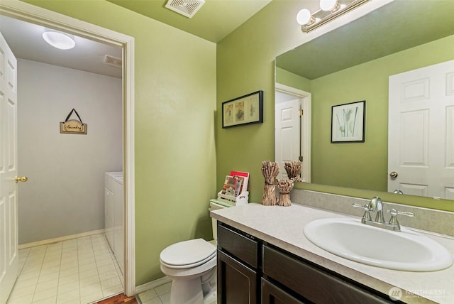 5118 NE 75th Ave, Vancouver, WA 98661 - bathroom featuring vanity, tile patterned floors, and washer and dryer