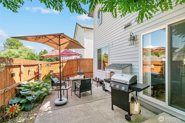 5118 NE 75th Ave, Vancouver, WA 98661 - fenced backyard featuring a fire pit, a grill, and a patio area
