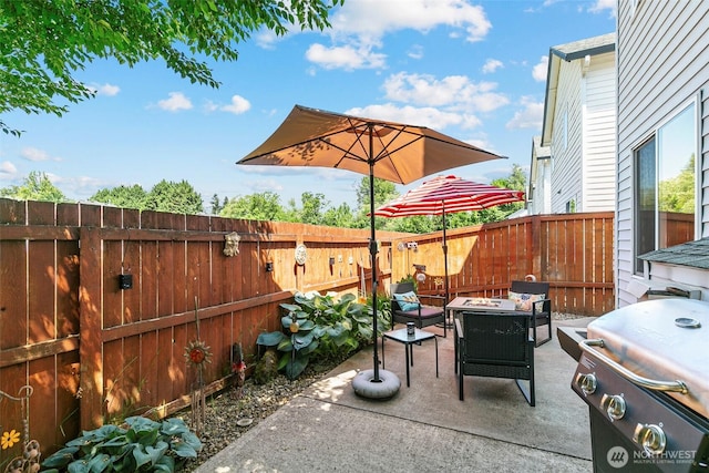 5118 NE 75th Ave, Vancouver, WA 98661 - fenced backyard featuring an outdoor fire pit, a patio area, and a grill