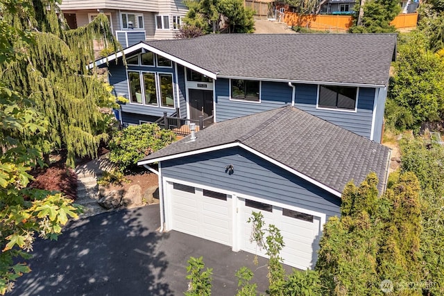 11520 3rd Ave NW, Seattle, WA 98177 - view of front facade with roof with shingles and asphalt driveway