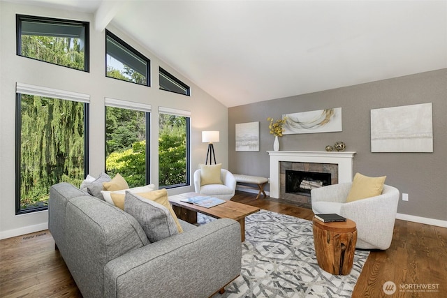 11520 3rd Ave NW, Seattle, WA 98177 - living area with a tile fireplace, high vaulted ceiling, wood finished floors, and beamed ceiling