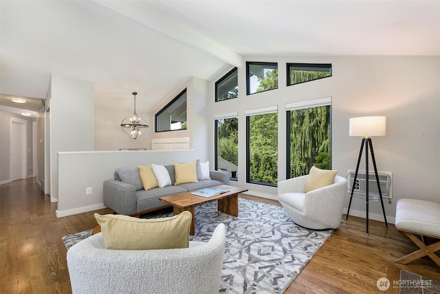 11520 3rd Ave NW, Seattle, WA 98177 - living room featuring a chandelier, beam ceiling, wood finished floors, high vaulted ceiling, and a wall mounted air conditioner