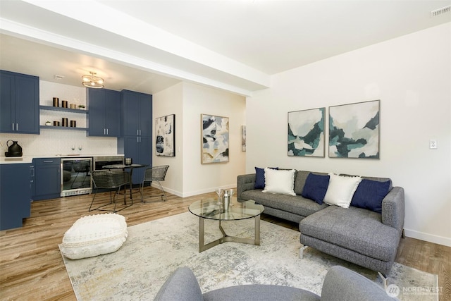11520 3rd Ave NW, Seattle, WA 98177 - living room featuring beverage cooler and light wood-style floors